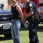 Samantha Chedester handcuffed by a Lemoore Police Officer. She portrayed a drunk driver in Every 15 Minutes.